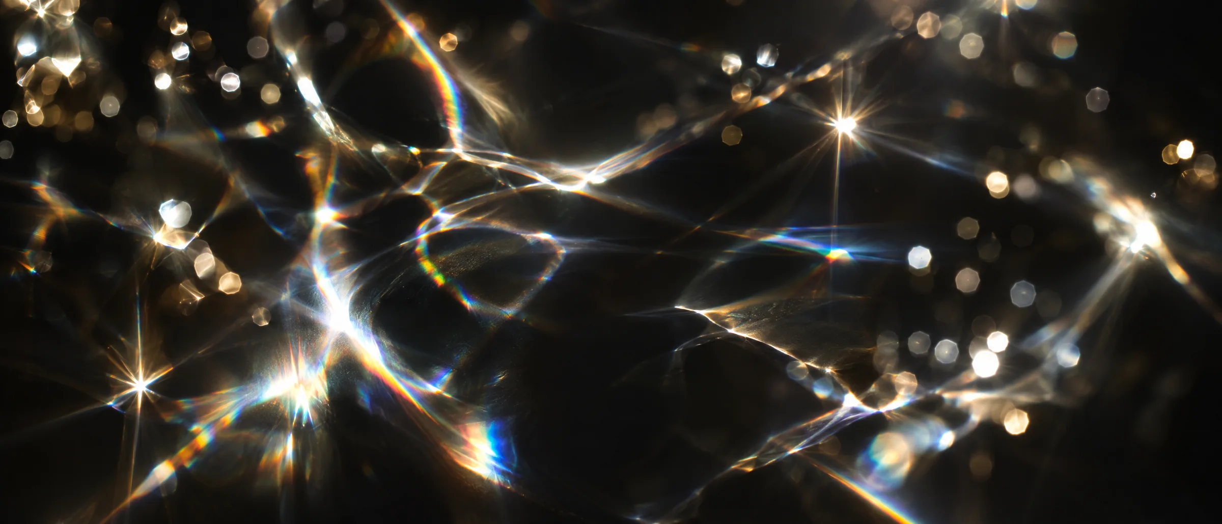 Light refracting from a diamond into caustic patterns